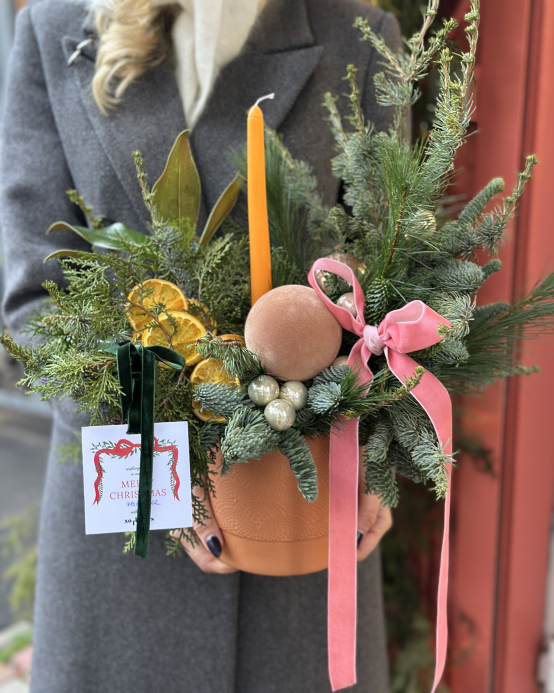 Winter arrangement in a clay pot