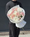 A beautiful bouquet of flowers featuring roses and chrysanthemums