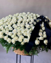 A mourning basket of white roses