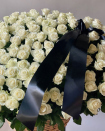 A mourning basket of white roses