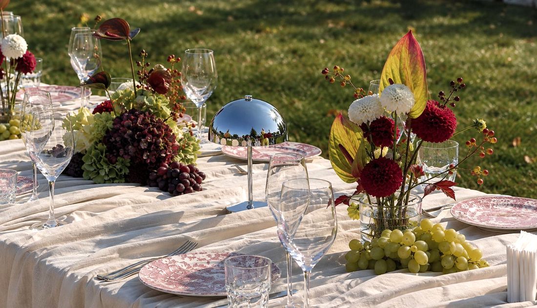 Decorating the party table with small bouquets and arrangements on a kenzan.